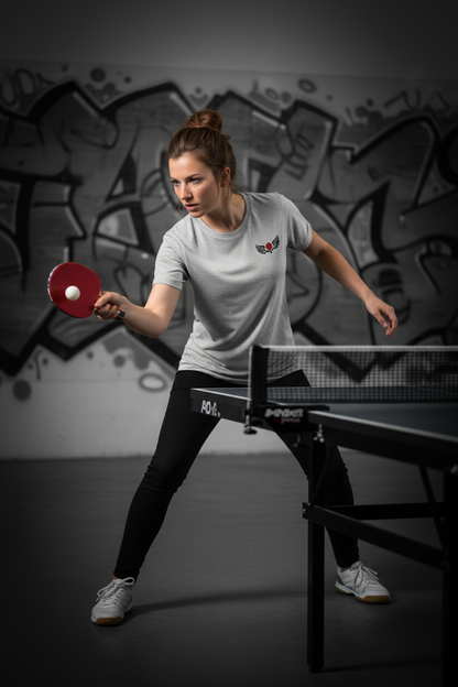 WINGS action shot - woman playing real table tennis